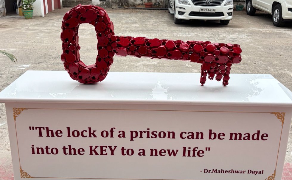 Key sculpture with Dr. Dayal's quote — The lock of a prison can be made into the KEY to a new life